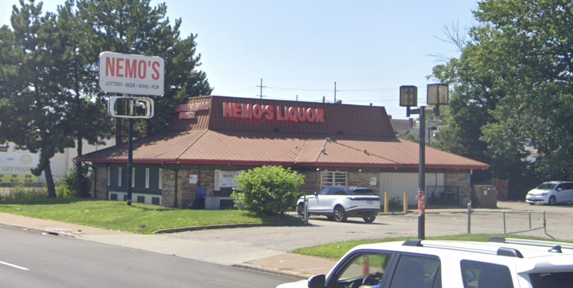 A liquor store labeled Nemo's, with a Pizza Hut-style roof.