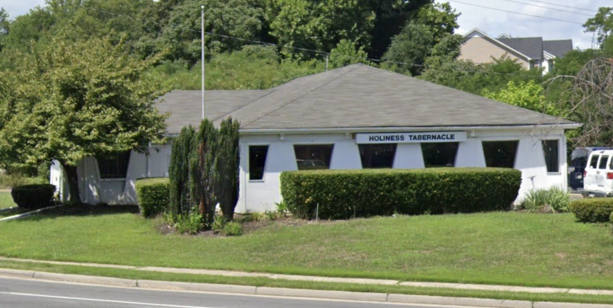 A church labeled Holiness Tabernacle, with Pizza Hut's trapezoidal windows.'